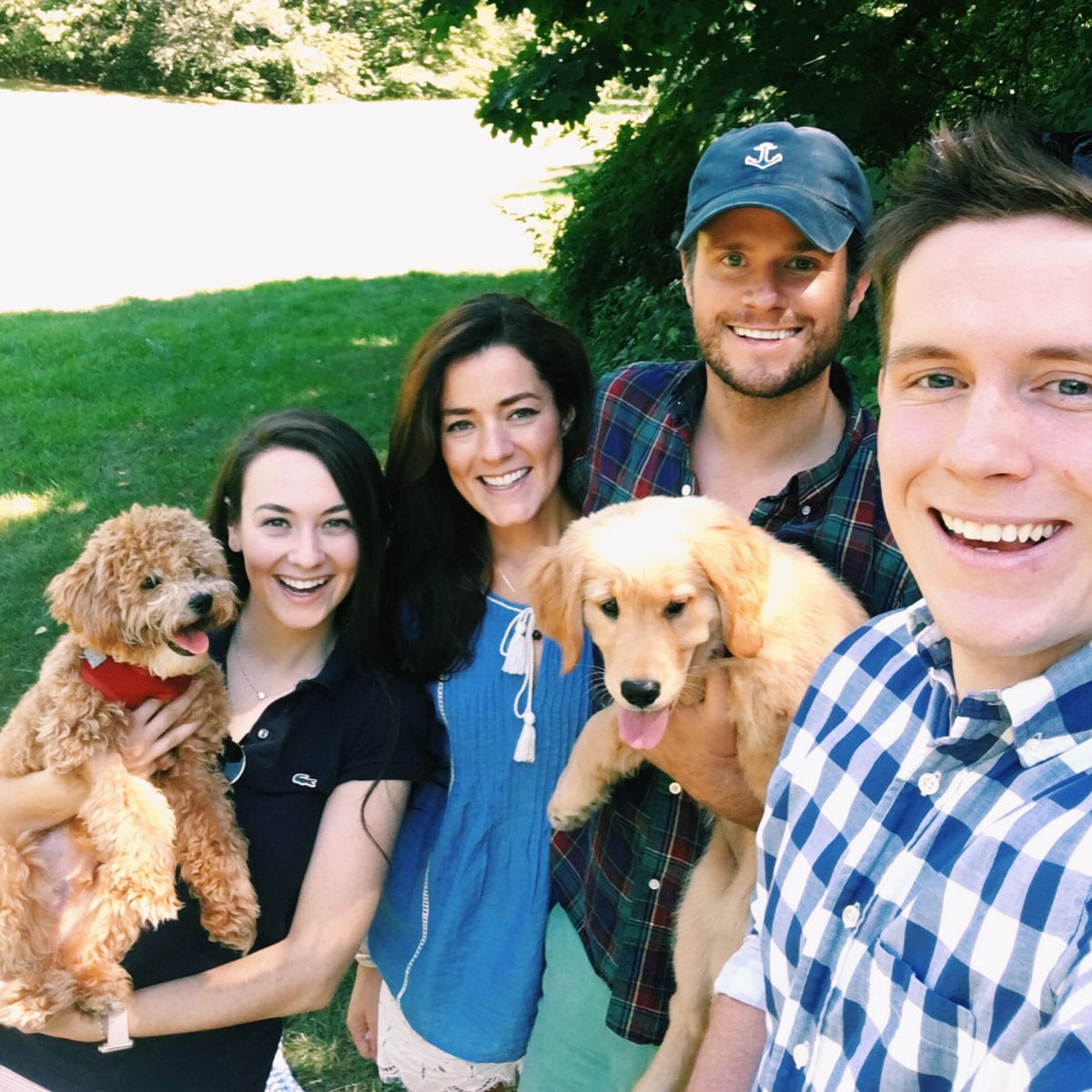 Kiel James Patrick and his wife Sarah Vickers with their golden retriever puppy Bennie.