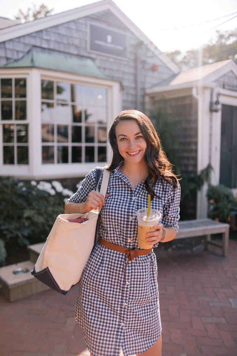 blogger Carly Riordan shares what to do in Nantucket including the Handlebar Cafe while wearing a navy and white gingham kiel james patrick dress and navy and canvas llbean boat and tote