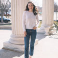 New Jersey blogger Carly Heitlinger is wearing Gal Meets Glam x Margaux blush espadrilles, button-fly jeans, and a cream cableknit cashmere sweater