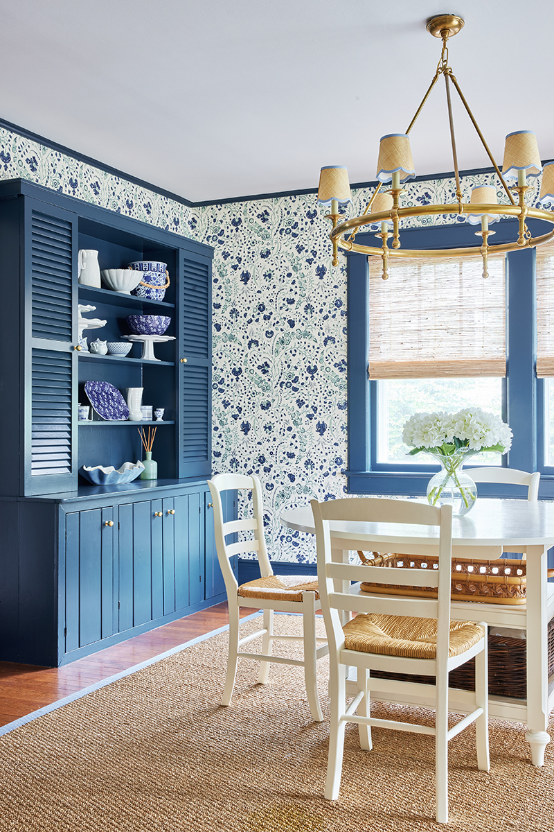 grandmillennial style dining room for carly riordan by jennifer muirhead interiors feauturing hague blue by farrow and ball, dianthus chintz soane wallpaper, serena & lily rosecliff chandelier, and pottery barn custom color-bound seagrass rug