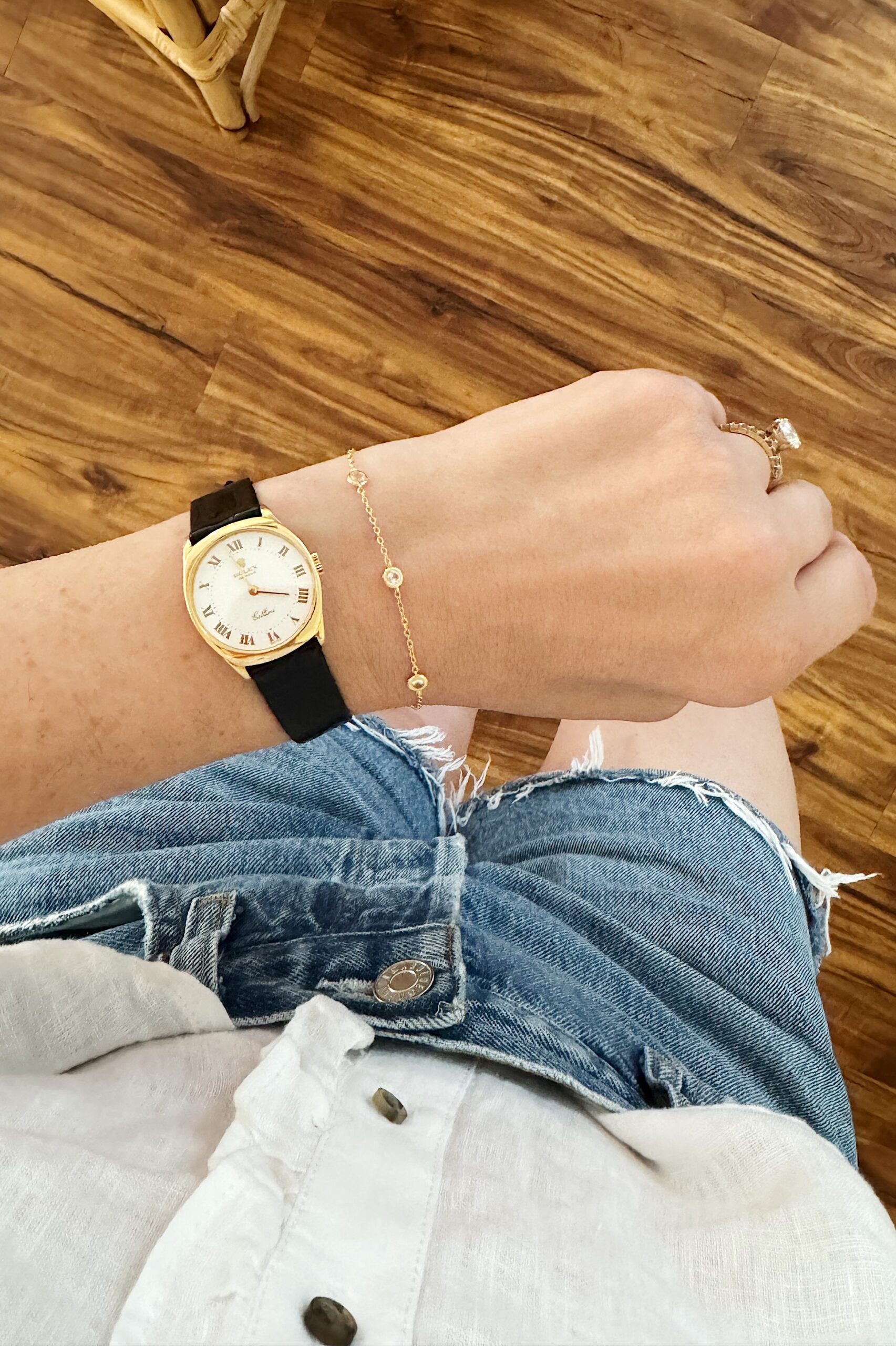 A black rolex watch with a dorsey diamond bracelet