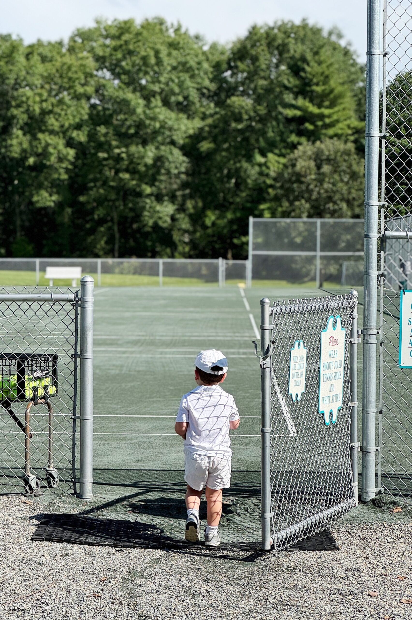 Jack walking into a tennis lesson