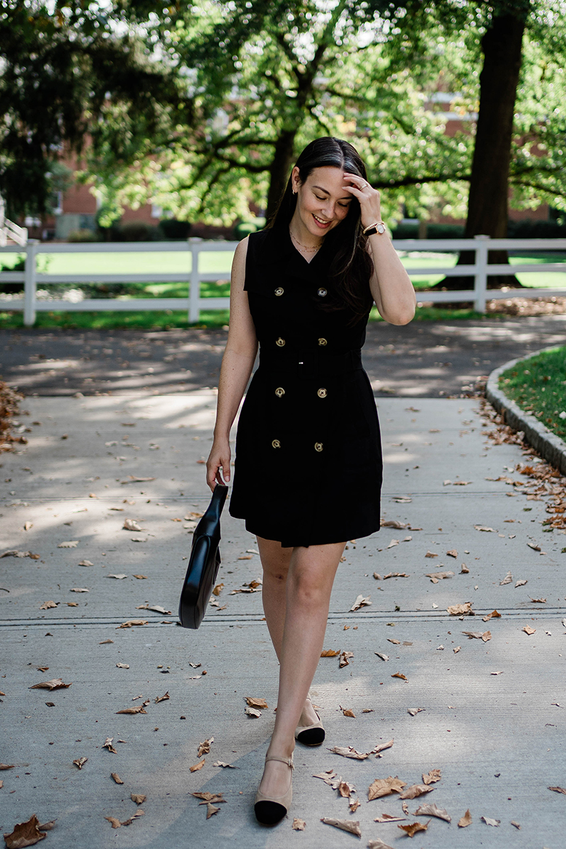 Carly Riordan wearing a black double breasted dress and cap toe mary janes from Tuckernuck. 