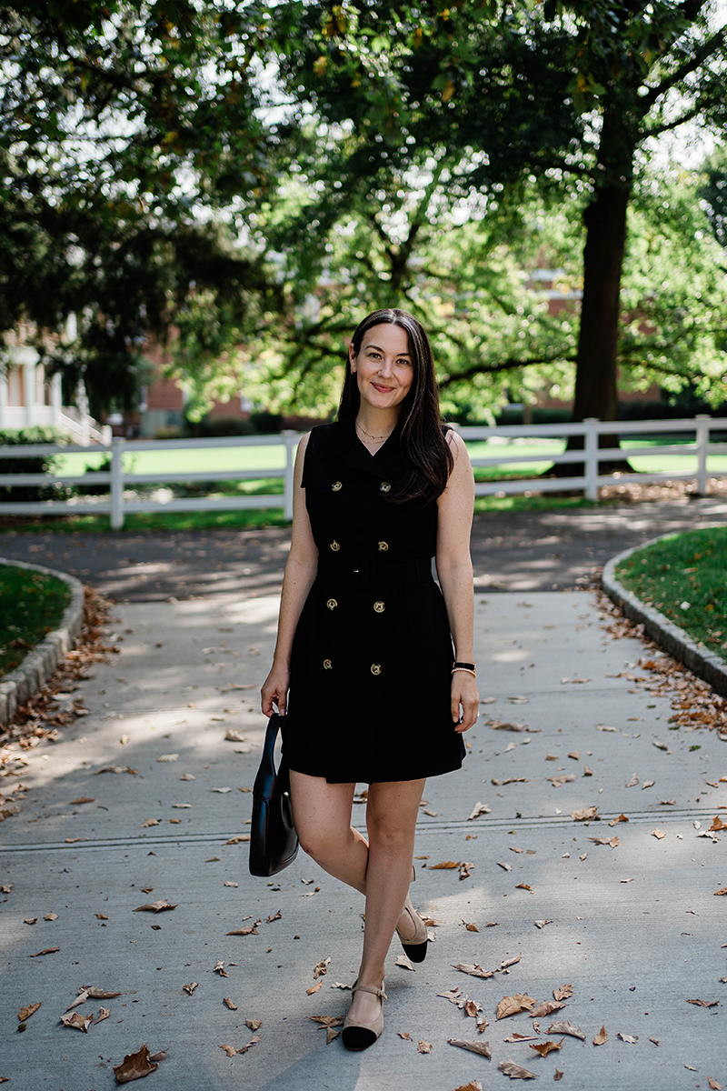 Carly Riordan wearing a black double breasted dress and cap toe mary janes from Tuckernuck. 