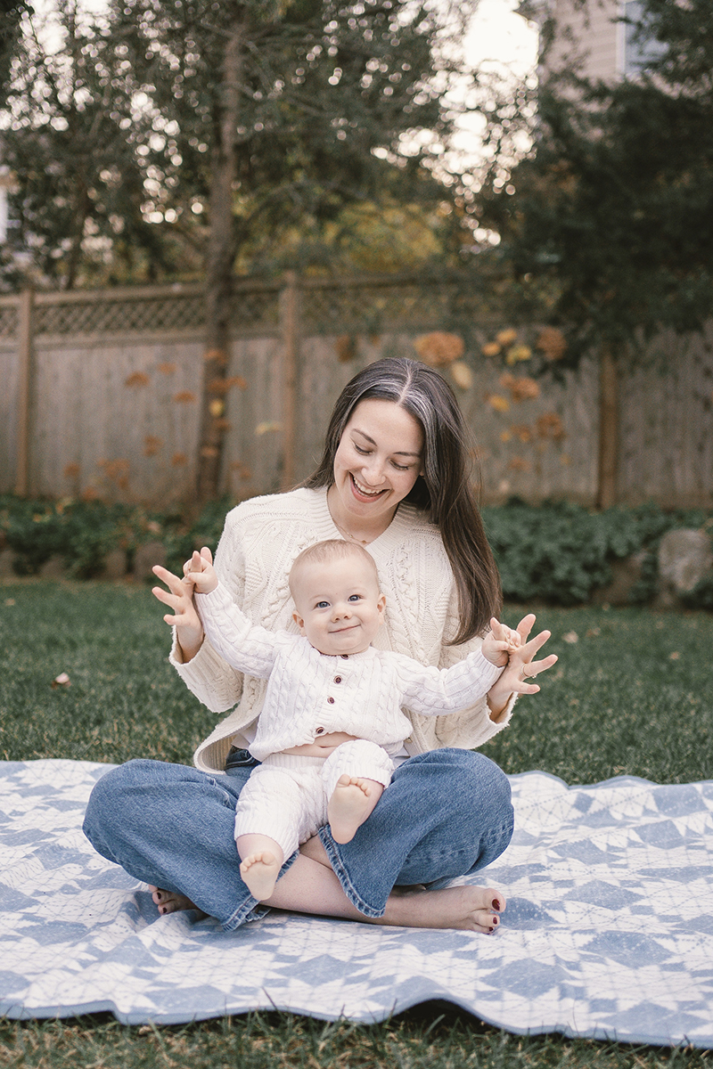 Carly holding her baby on her lap