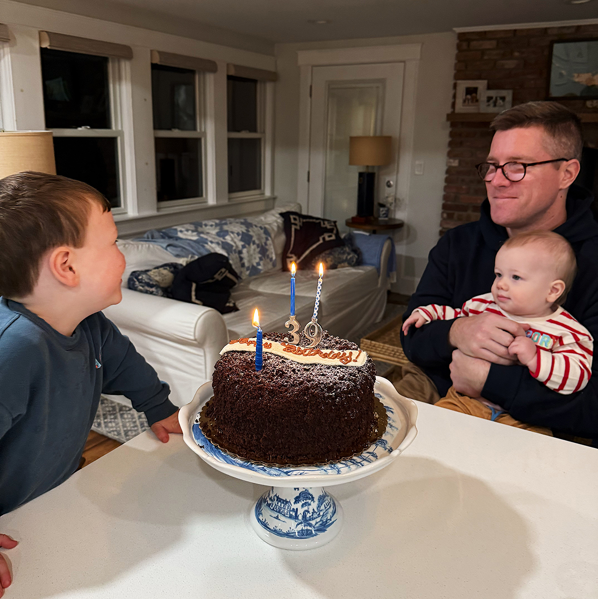 Mike, Jack, and Rory getting ready to blow out birthday candles