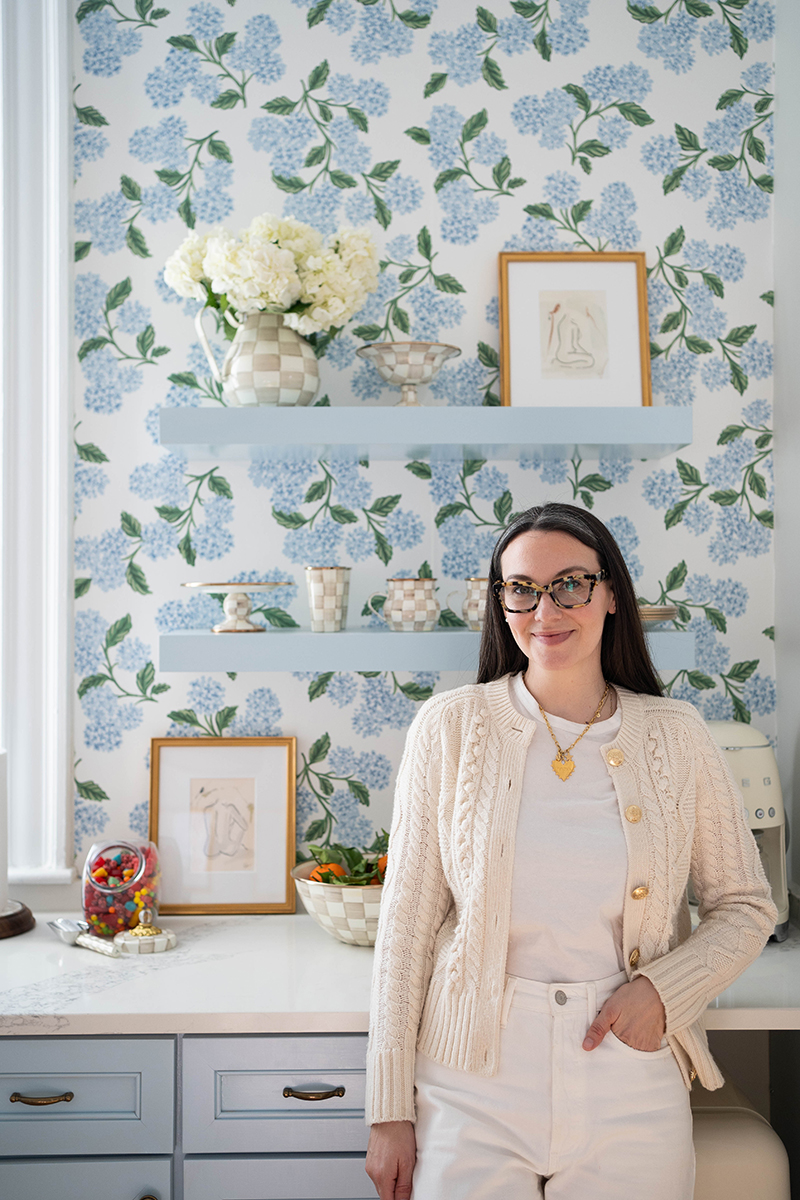 Carly in her office kitchenette with pieces of Mackenzie Childs' new Mocha Check collection.