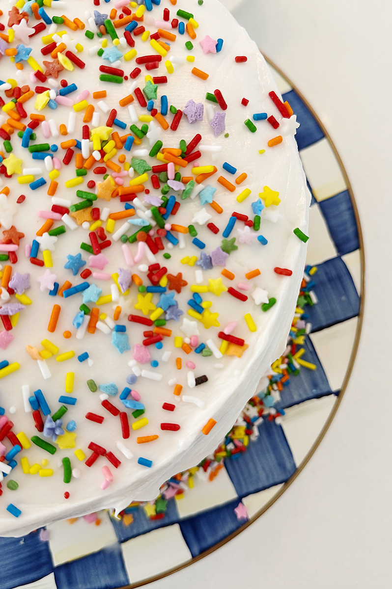 A birthday cake with rainbow sprinkles